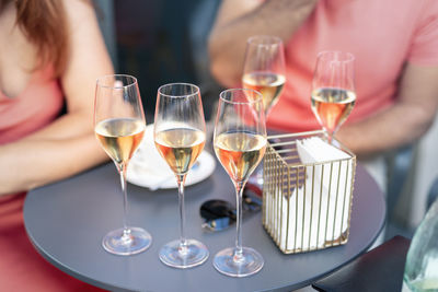 Close-up of wine glasses on table