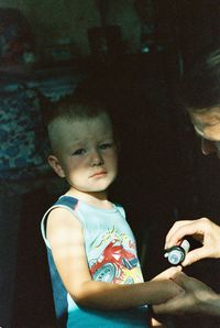 Portrait of cute boy looking at home