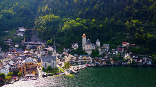 High angle view of townscape by sea