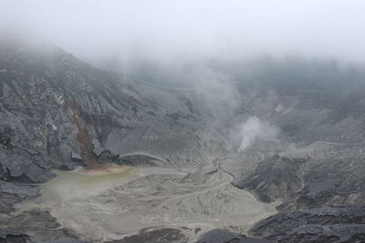 Smoke emitting from volcanic mountain