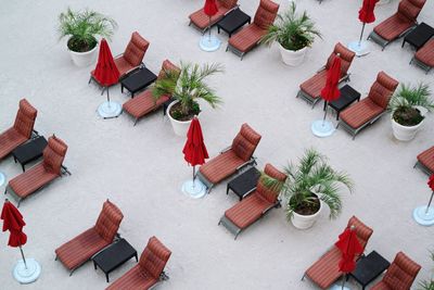 High angle view of lounge chairs at beach