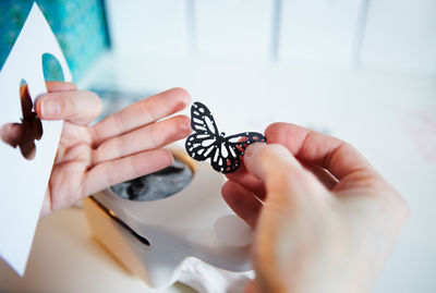 Close-up of hand holding christmas decoration