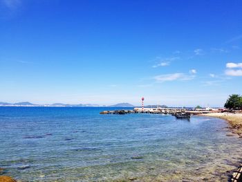 Scenic view of sea against blue sky