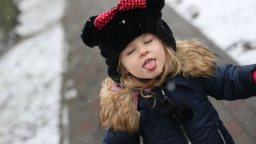 Portrait of happy girl in snow