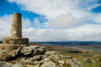 View of old ruins against cloudy sky