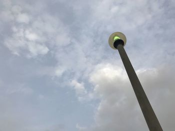 Low angle view of communications tower against sky