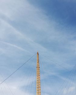 Low angle view of metallic built structure against sky