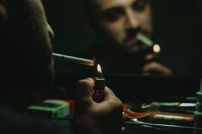 Close-up of man smoking cigarette