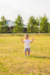 Full length of boy on field