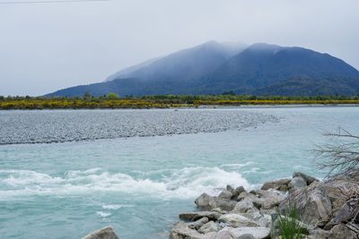 Beautiful blue stream and mountains scenery in new zealand.