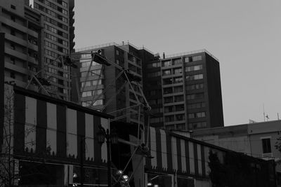 Low angle view of office building against clear sky