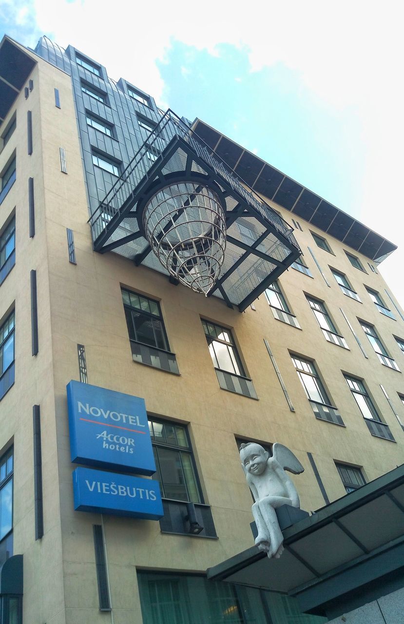 low angle view, building exterior, day, architecture, built structure, outdoors, no people, clock, bird, sky