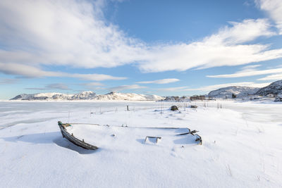 Scenic view of landscape against sky during winter