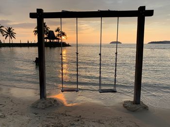 Scenic view of beach against sky during sunset