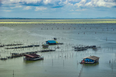 High angle view of sailboats in sea against sky