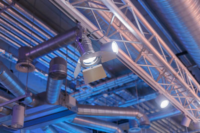 Low angle view of illuminated light bulbs on ceiling