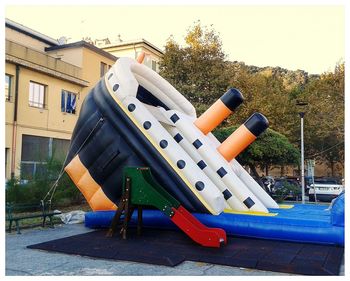 View of playground against buildings in city