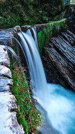 Scenic view of waterfall in forest