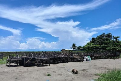 Abandoned built structure on field against sky