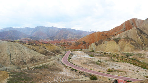 Scenic view of mountain road against sky