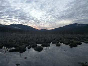 Scenic view of lake against sky during sunset