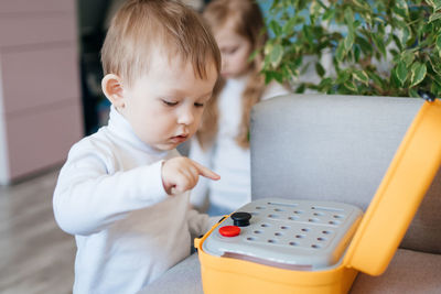Funny toddler boy playing a game. high quality photo