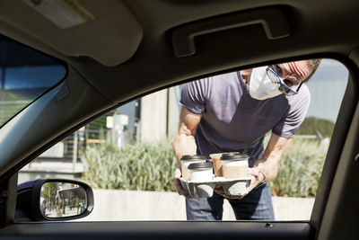 Take out coffee delivered to car window