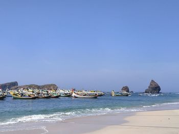 Scenic view of sea against clear blue sky