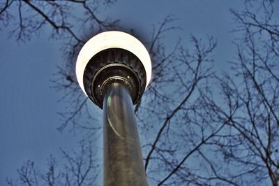 Low angle view of communications tower against sky