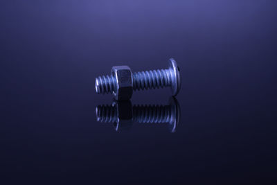 Close-up of electric lamp against black background