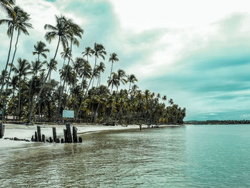 Scenic view of sea against cloudy sky