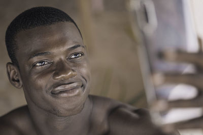 Close-up of happy young black man making a selfie with smartphone