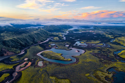 Aerial view of landscape against sky during sunset