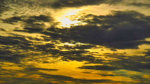 Low angle view of dramatic sky during sunset