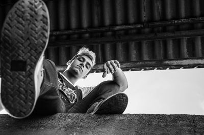 Portrait of young man sitting outdoors