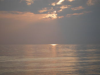 Scenic view of sea against sky at sunset