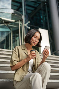 Young woman using mobile phone