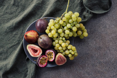 Platter of passion fruit grapes and figs