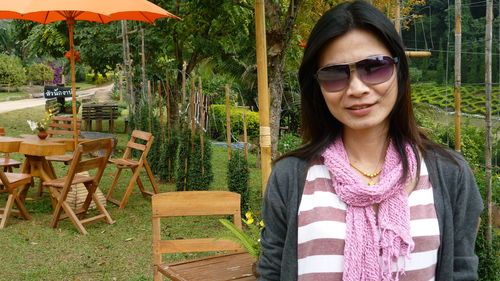 Portrait of smiling mature woman standing in park