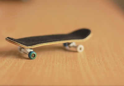 Close-up of fingerboard on table
