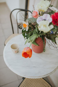 High angle view of roses in vase on table