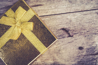 High angle view of gift box on wooden table