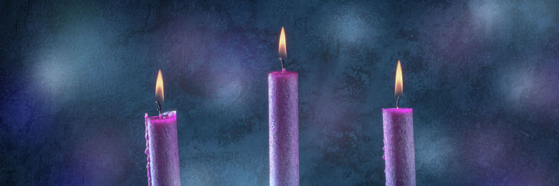 Close-up of burning candles