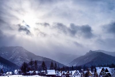 Scenic view of mountains against sky during winter