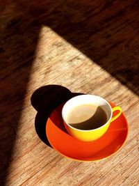 High angle view of coffee cup on table