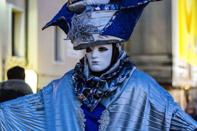 Close-up of person wearing venetian mask 