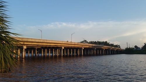 Bridge over sea against sky