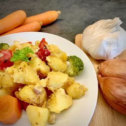 High angle view of fruits in plate on table