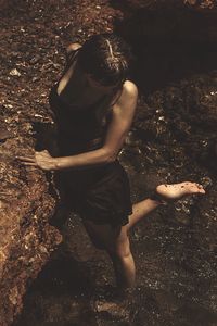 Close-up of woman standing in pond