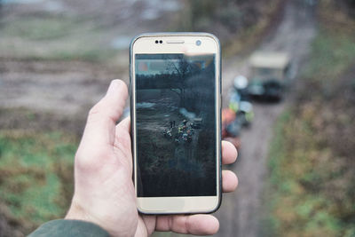 Close-up of hand holding smart phone